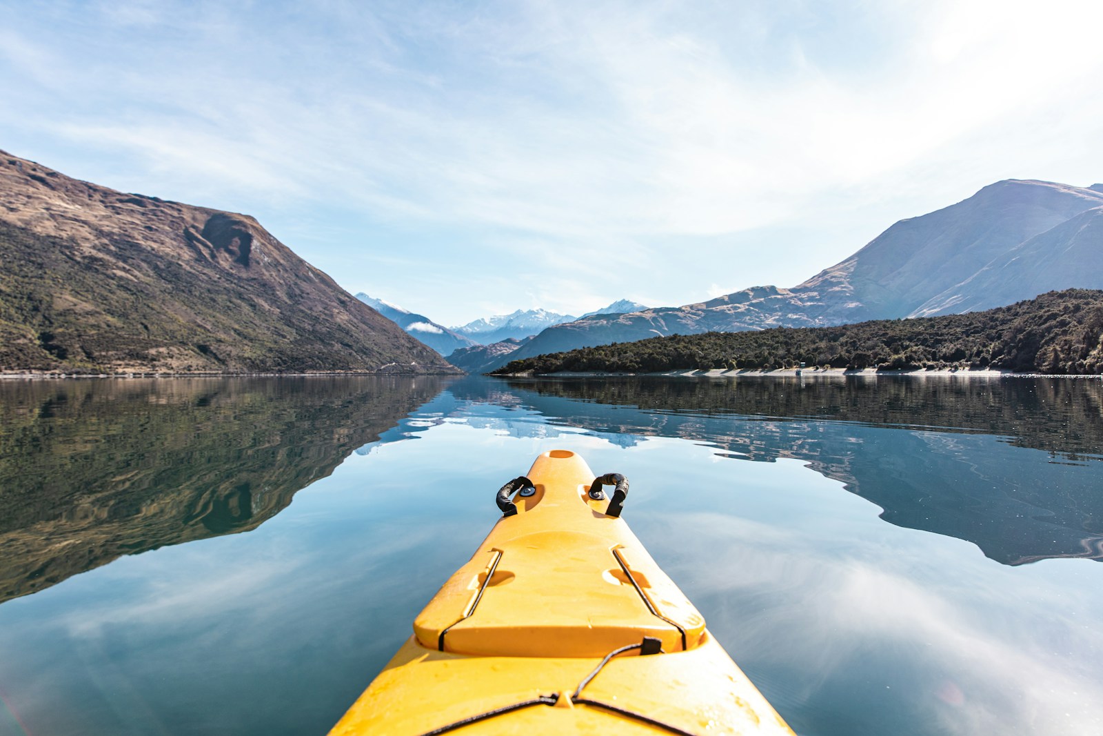 yellow kayak on calm body of water